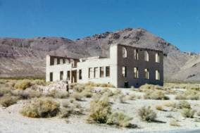 28 Ghost Towns in Nevada: Eerie Ruins, History & Visiting Tips Rhyolite20School 1