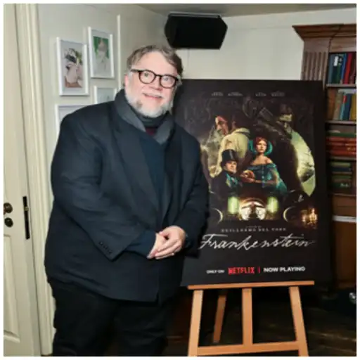 Guillermo del Toro with his Frankenstein poster