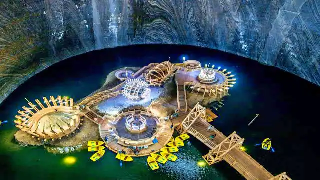 Illuminated island and boat dock on Terezia Lake
