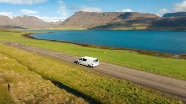 Campervan cruising along the scenic Icelandic coast