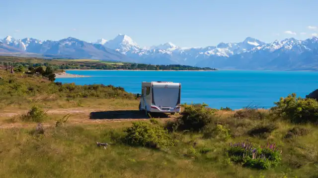 NZ Freedom Camping Rules: Green Warrant & Fines Guide beside Lake Pukaki